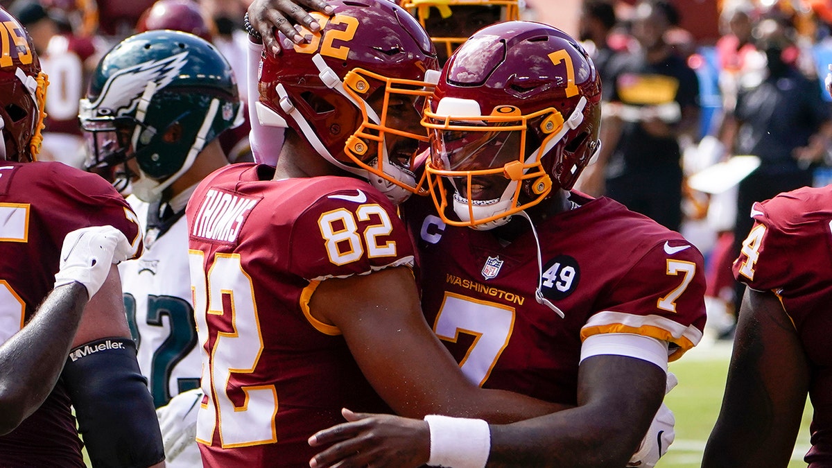 Washington Football Team tight end Logan Thomas (82) celebrates his touchdown against Philadelphia Eagles with teammate quarterback Dwayne Haskins (7), during the first half of an NFL football game, Sunday, Sept. 13, 2020, in Landover, Md. (AP Photo/Susan Walsh)