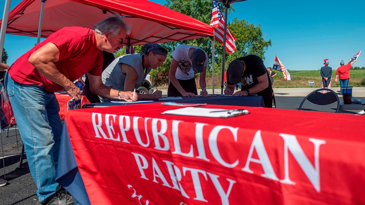 People registar to vote during a Republican voter registration in Brownsville, Pennsylvania on September 5, 2020. - Less than two months before the November 3 presidential election, the contrast between Republicans and Democrats is striking in Washington County, in the suburbs of Pittsburgh. (Photo by ANDREW CABALLERO-REYNOLDS / AFP) (Photo by ANDREW CABALLERO-REYNOLDS/AFP via Getty Images)