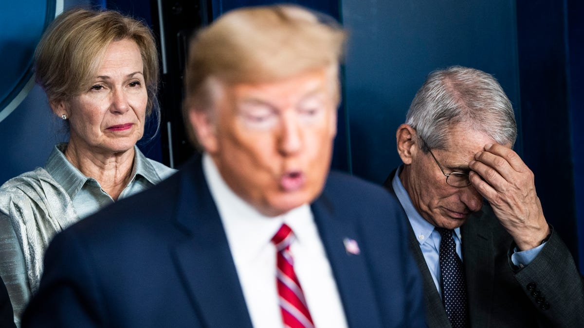 Dr. Deborah Birx, White House coronavirus response coordinator, and National Institute for Allergy and Infectious Diseases Director Dr. Anthony Fauci listen as President Donald Trump speaks with the coronavirus task force during a briefing on Friday, March 20, 2020, in Washington, D.C.