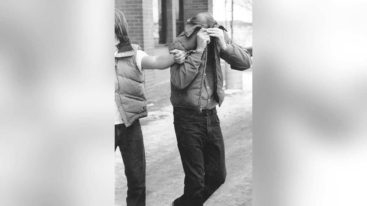 Robert Hansen leaves court during a hearing on multiple murder charges in November 1983.
