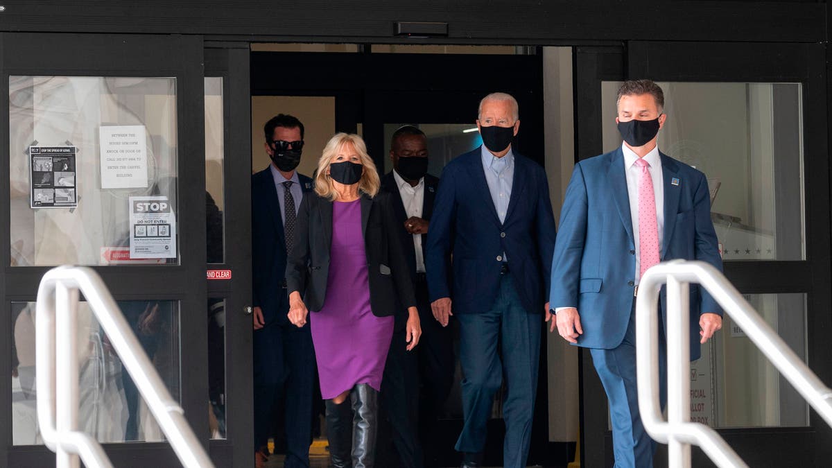 Democratic presidential candidate Joe Biden walks out of the state building with his wife Jill, after voting in the Delaware state primary in Wilmington, Delaware on September 14. 