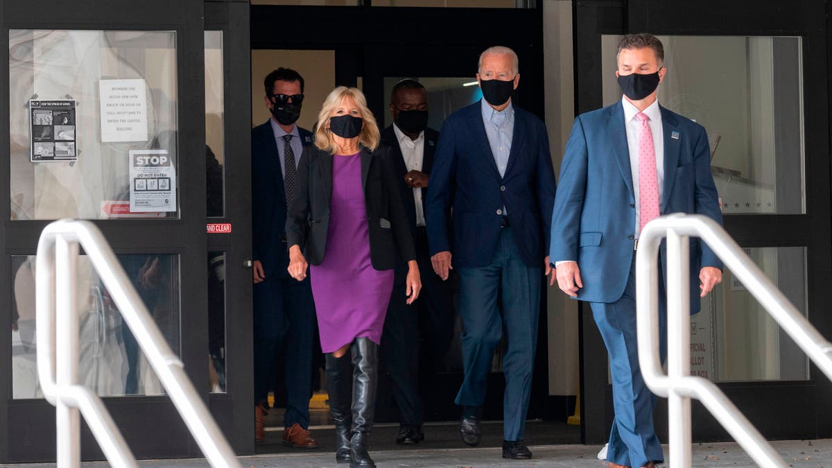 Democratic presidential candidate Joe Biden walks out of the state building with his wife Jill, after voting in the Delaware state primary in Wilmington, Delaware on September 14.