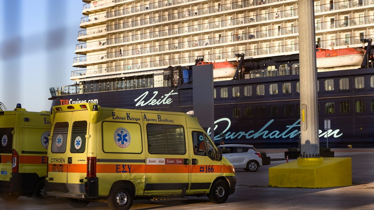 Ambulance waiting outside the Mein Schiff 6 cruise ship as is docked at Piraeus port on Sept. 29. (Dimitris Lampropoulos/NurPhoto via Getty Images)