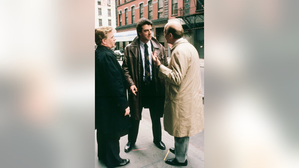 LAW &amp; ORDER -- "The Blue Wall" Episode 22 -- Air Date 06/09/1991 -- Pictured: (l-r) John Christopher Jones as Dennis Shearer, Chris Noth as Detective Mike Logan and Gerry Bamman as Internal Affairs Lt. Kennedy