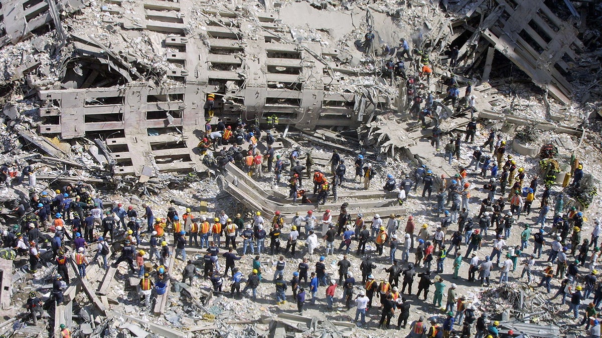 Rescue workers sift through the wreckage of the World Trade Center Sept. 13, 2001 in New York City, two days after two hijacked airplanes slammed into the twin towers, levelling them in an alleged terrorist attack. (Mario Tama/Getty Images)
