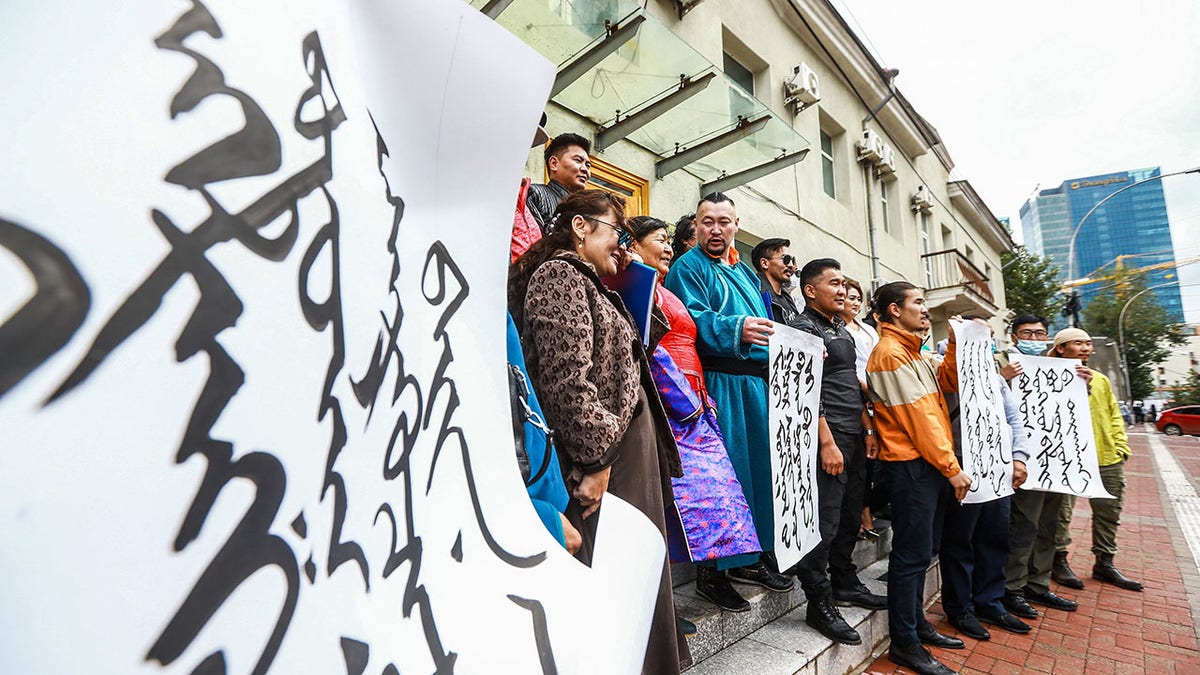 Mongolians protest at the Ministry of Foreign Affairs in Ulaanbaatar, the capital of Mongolia, against China's plan to introduce Mandarin-only classes at schools in the neighboring Chinese province of Inner Mongolia on Monday. (Photo by Byambasuren Byamba-Ochir/AFP via Getty Images)