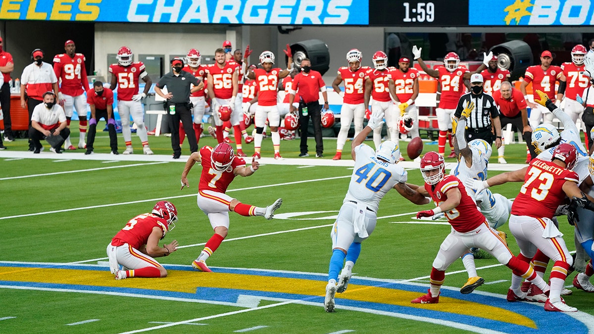 Kansas City Chiefs kicker Harrison Butker (7) hits the game-winning field goal during overtime of an NFL football game against the Los Angeles Chargers Sunday, Sept. 20, 2020, in Inglewood, Calif. Kansas City won 23-20. (AP Photo/Ashley Landis )