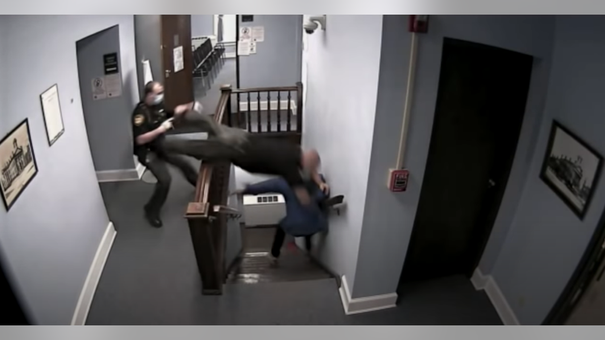 Highland County Sheriff’s Deputy Ben Reno is captured on surveillance video leaping over a stair railing.