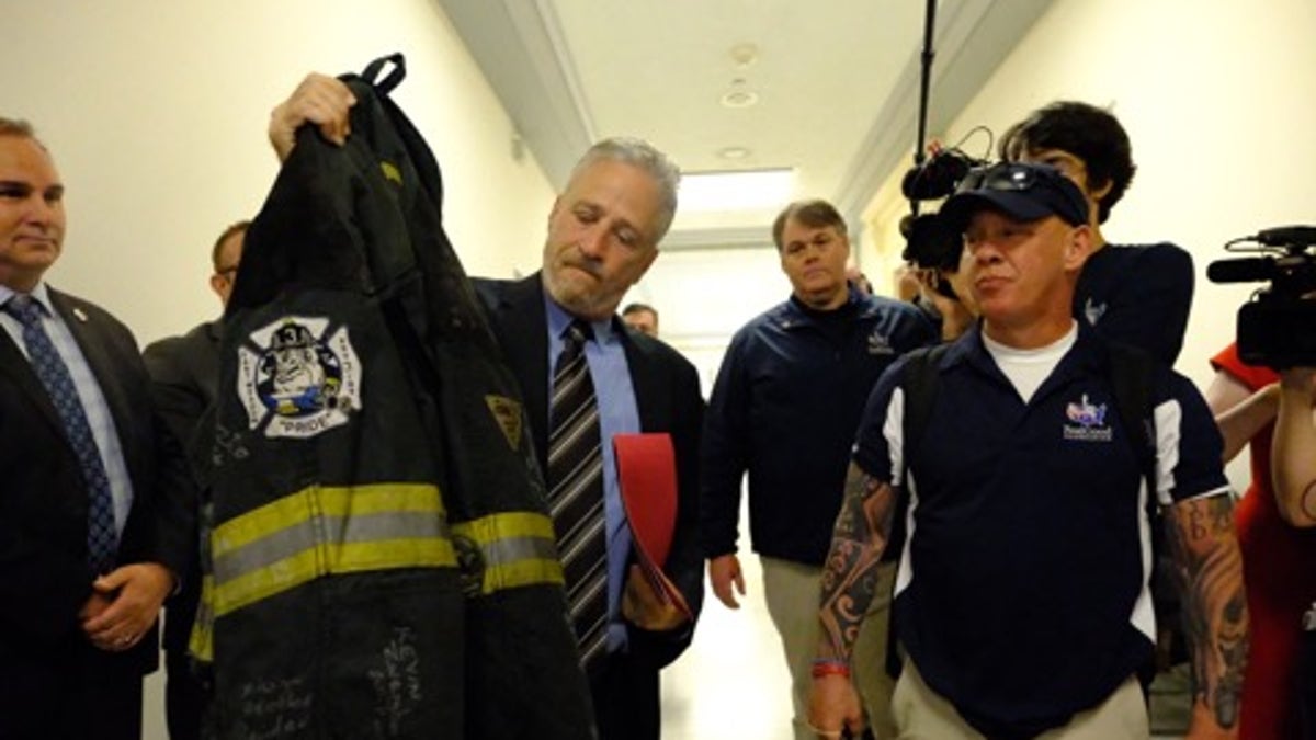 Jon Stewart and Jon Feal (right), who successfully fought for compensation due to 9/11 first responders, are now focusing their efforts to lobby for a new bill that will provide the same sort of relief for U.S. Veterans who claim they were made sick from burn pit exposure.