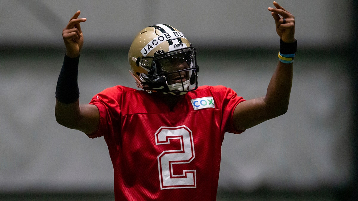 Wearing the name of Jacob Blake on his helmet, New Orleans Saints quarterback Jameis Winston (2) dances during an NFL football training camp practice inside the Ochsner Sports Performance Center in Metairie, La., Thursday, Aug. 27, 2020. (David Grunfeld/The Advocate via AP, Pool)