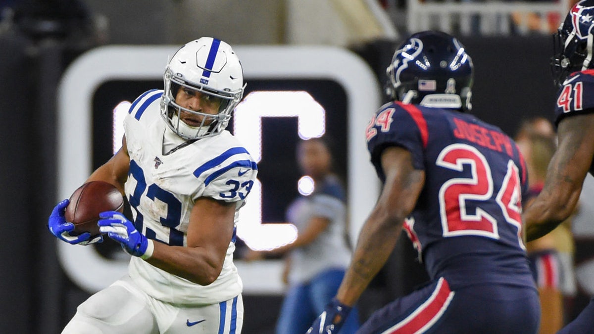 Indianapolis Colts running back Jonathan Williams (33) attempts to get to the edge as Houston Texans cornerback Johnathan Joseph (24) and Houston Texans inside linebacker Zach Cunningham (41) close in during the football game between the Indianapolis Colts and Houston Texans at NRG Stadium on November 21, 2019 in Houston, TX. (Photo by Ken Murray/Icon Sportswire via Getty Images)