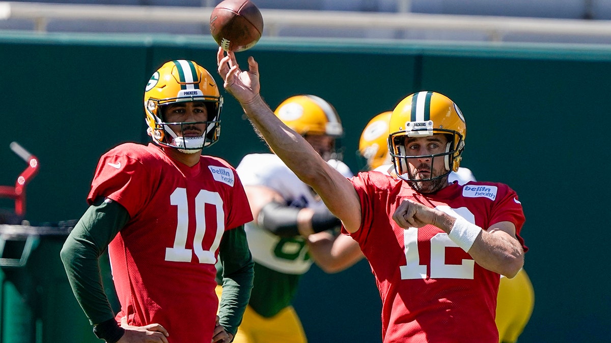 Green Bay Packers' Jordan Love watches Aaron Rodgers throw during NFL football practice Friday, Sept. 4, 2020, in Green Bay, Wis. (AP Photo/Morry Gash)