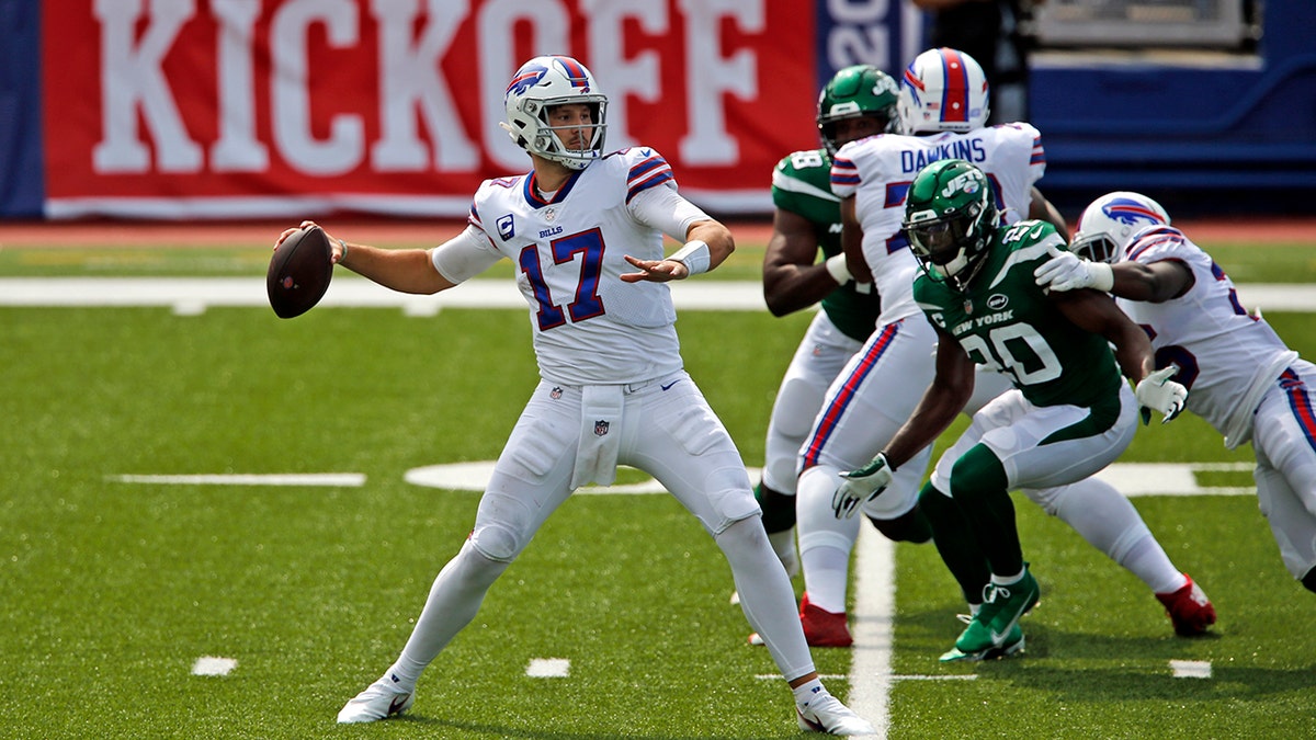 Buffalo Bills quarterback Josh Allen (17) throws a pass during the first half of an NFL football game against the New York Jets in Orchard Park, N.Y., Sunday, Sept. 13, 2020. (AP Photo/John Munson)