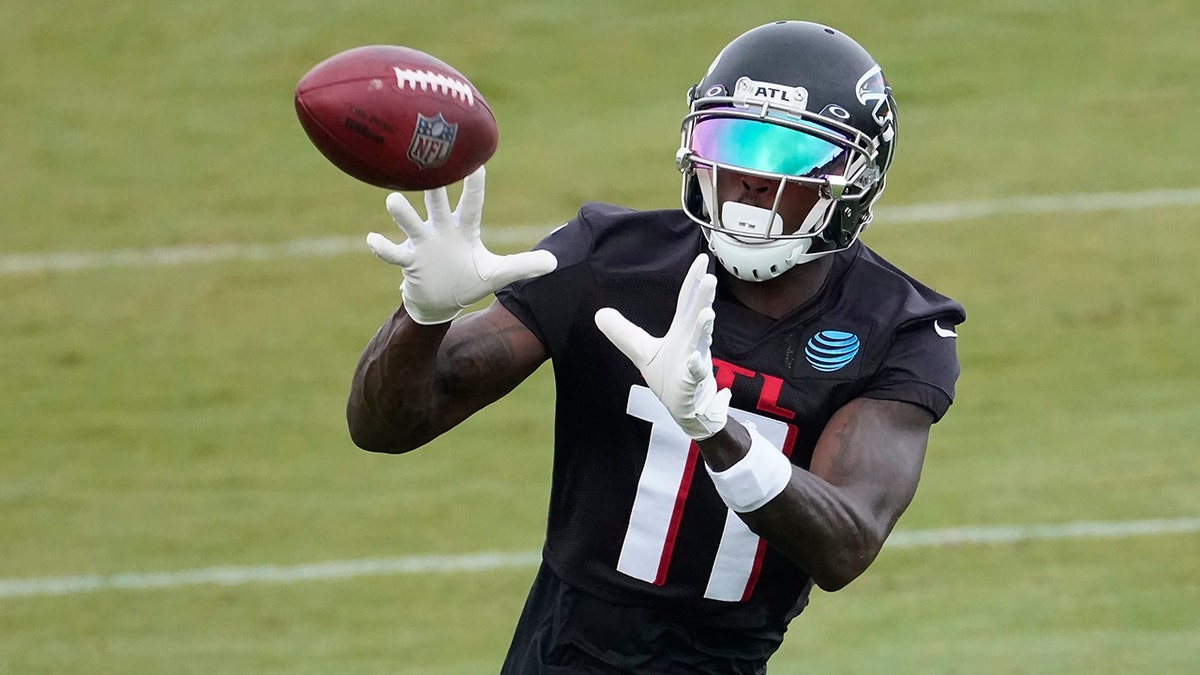 Atlanta Falcons wide receiver Julio Jones (11) makes a catch during an NFL training camp football practice Sunday, Aug. 23, 2020, in Atlanta. (AP Photo/John Bazemore, Pool)