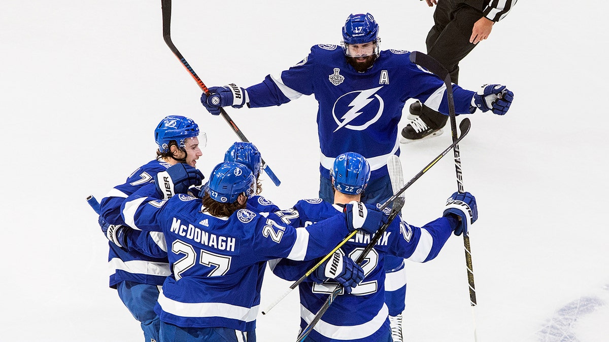 Tampa Bay Lightning' Kevin Shattenkirk (22) celebrates his goal with teammates during first-period NHL Stanley Cup finals hockey action against the Dallas Stars in Edmonton, Alberta, Monday, Sept. 21, 2020. (Jason Franson/The Canadian Press via AP)