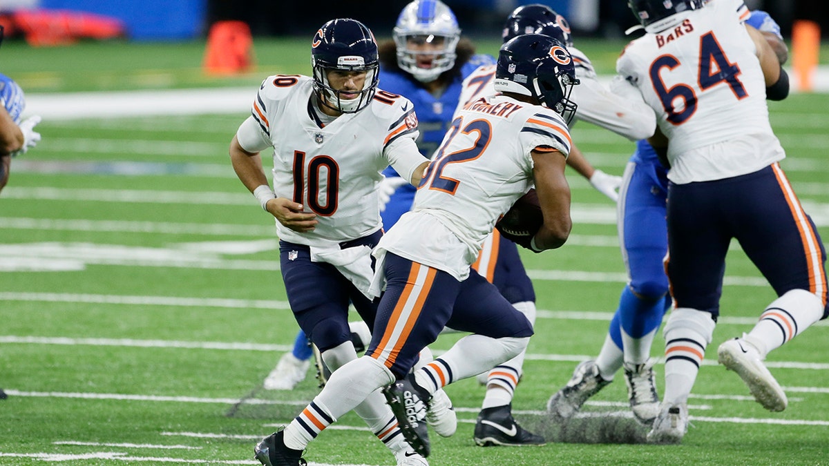 Chicago Bears quarterback Mitchell Trubisky (10) hands off to running back David Montgomery (32) in the second half of an NFL football game in Detroit, Sunday, Sept. 13, 2020. (AP Photo/Duane Burleson)