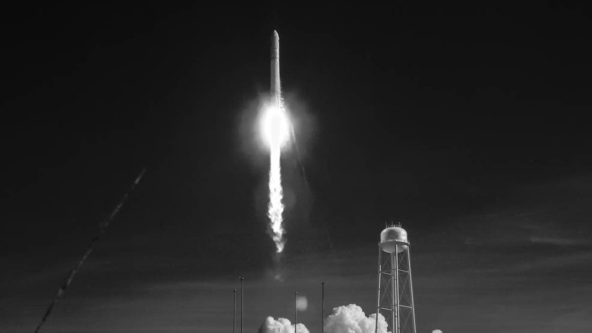 Northrop Grumman's Antares rocket, with Cygnus resupply spacecraft onboard, launches from Pad-0A, Wednesday, April 17, 2019 at NASA's Wallops Flight Facility in this black and white infrared photograph.