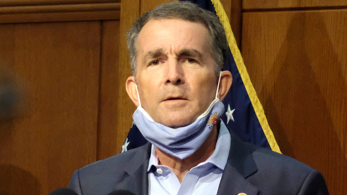 In this Sept. 1, 2020 file photo, Virginia Gov. Ralph Northam listens to a reporter's question during a press briefing inside the Patrick Henry Building in Richmond. (Bob Brown/Richmond Times-Dispatch via AP)
