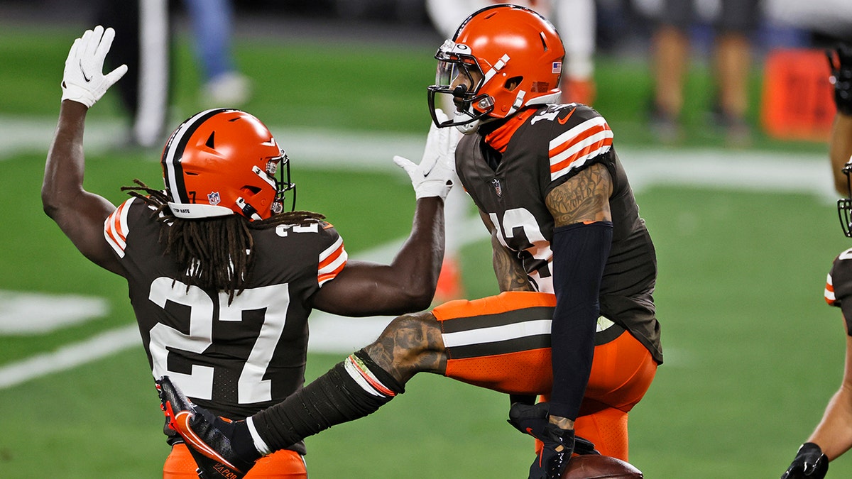 Cleveland Browns wide receiver Odell Beckham Jr., right, celebrates with running back Kareem Hunt after Beckham's touchdown during the first half of the team's NFL football game against the Cincinnati Bengals, Thursday, Sept. 17, 2020, in Cleveland. (AP Photo/Ron Schwane)
