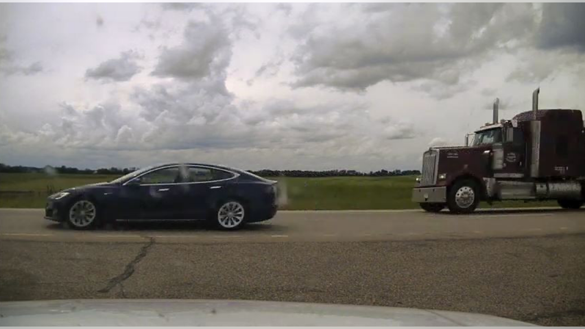 Photo of Tesla Model S with reclined seats.