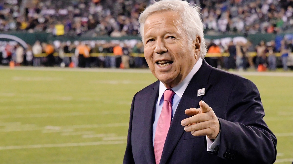 New England Patriots owner Robert Kraft points to fans as his team warms up before an NFL football game against the New York Jets in East Rutherford, N.J on Oct. 21, 2019. 