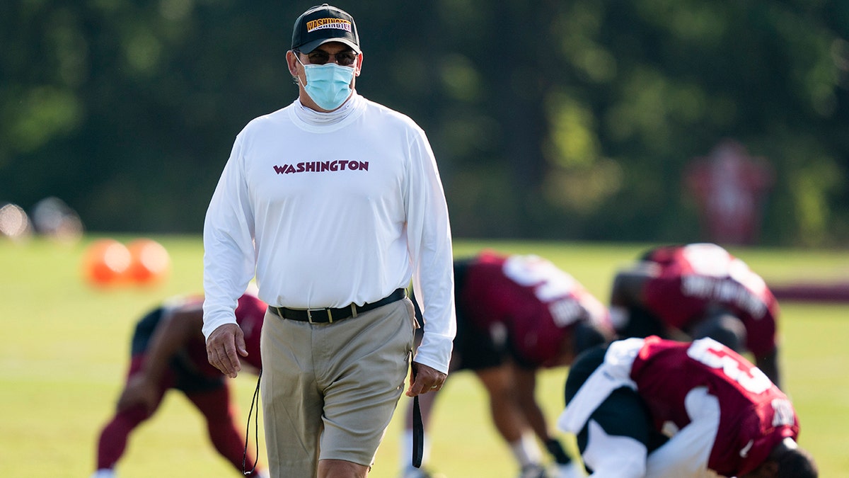 Washington head coach Ron Rivera walks on the field during practice at the team's NFL football training facility, Tuesday, Aug. 25, 2020, in Ashburn, Va. (AP Photo/Alex Brandon)