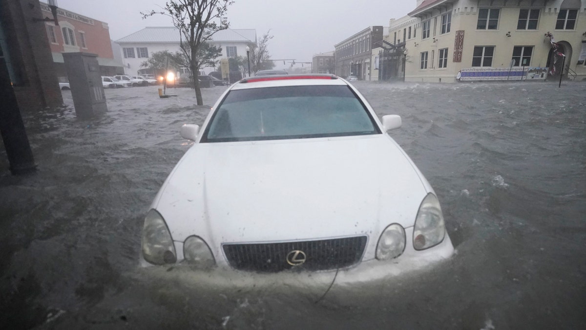 Floodwaters move on the street, Wednesday, Sept. 16, 2020, in Pensacola, Fla. as Hurricane Sally made landfall.