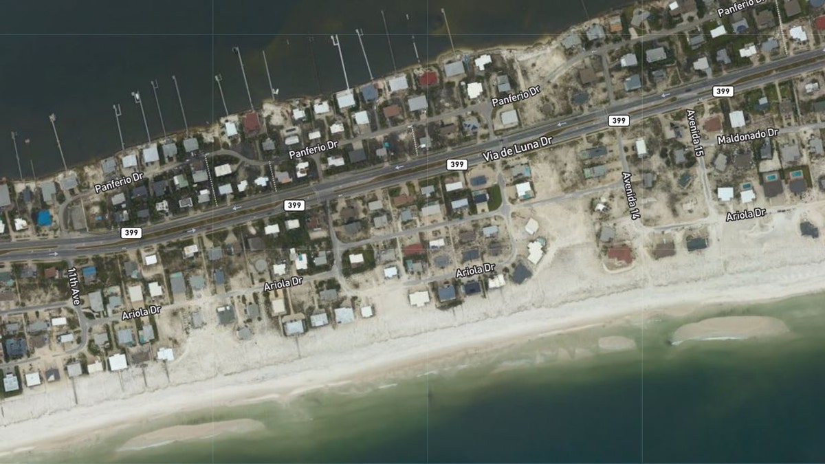 Sand was pushed around homes in Pensacola Beach, Fla., after Hurricane Sally roared through the region.