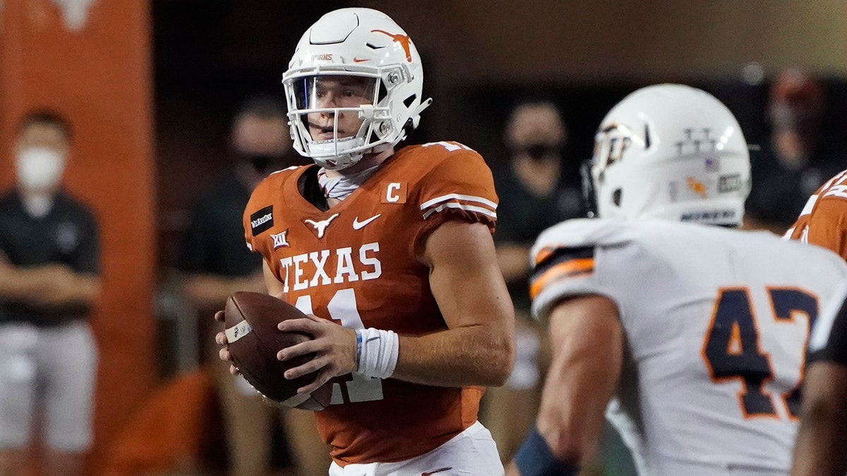 Texas' Sam Ehlinger (11) looks to pass against UTEP during the first half of an NCAA college football game in Austin, Texas, Saturday, Sept. 12, 2020. (AP Photo/Chuck Burton)