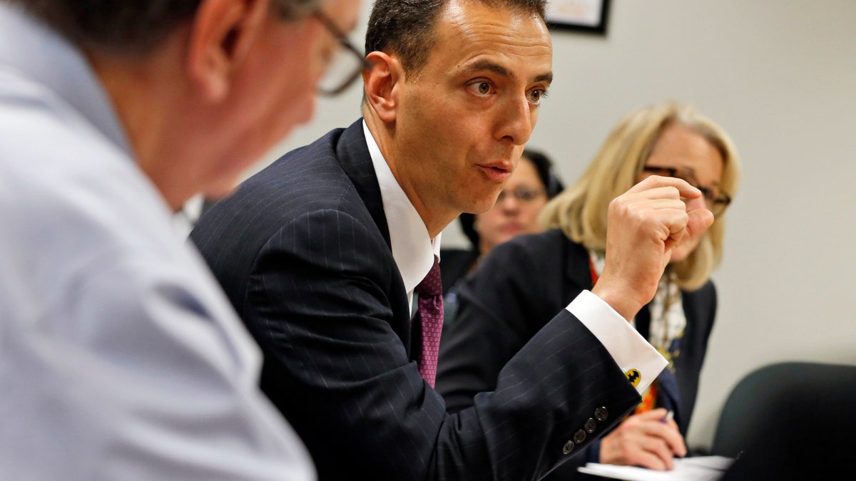 FILE - In this Feb. 4, 2016, file photo, Del. Marcus Simon D-Fairfax, speaks during a meeting of the Privileges and Elections subcommittee at the Capitol in Richmond, Va. A bill making its way through the House would require police chiefs to notify the Criminal Justice Services Board or a civilian review panel if an officer has received three complaints of excessive force in the previous five years. Simon, the bill's chief sponsor, said three complaints would not automatically trigger a decertification hearing, but would act as an "early warning system" to detect a pattern that requires further investigation and could lead to decertification. (AP Photo/Steve Helber, File)