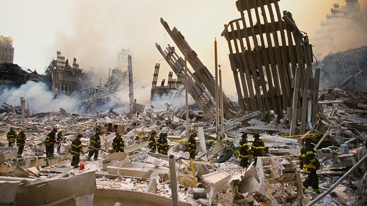 The rubble of the World Trade Center smoulders following a terrorist attack September 11, 2001 in New York. A hijacked plane crashed into and destroyed the landmark structure. (Photo by Porter Gifford/Corbis via Getty Images)