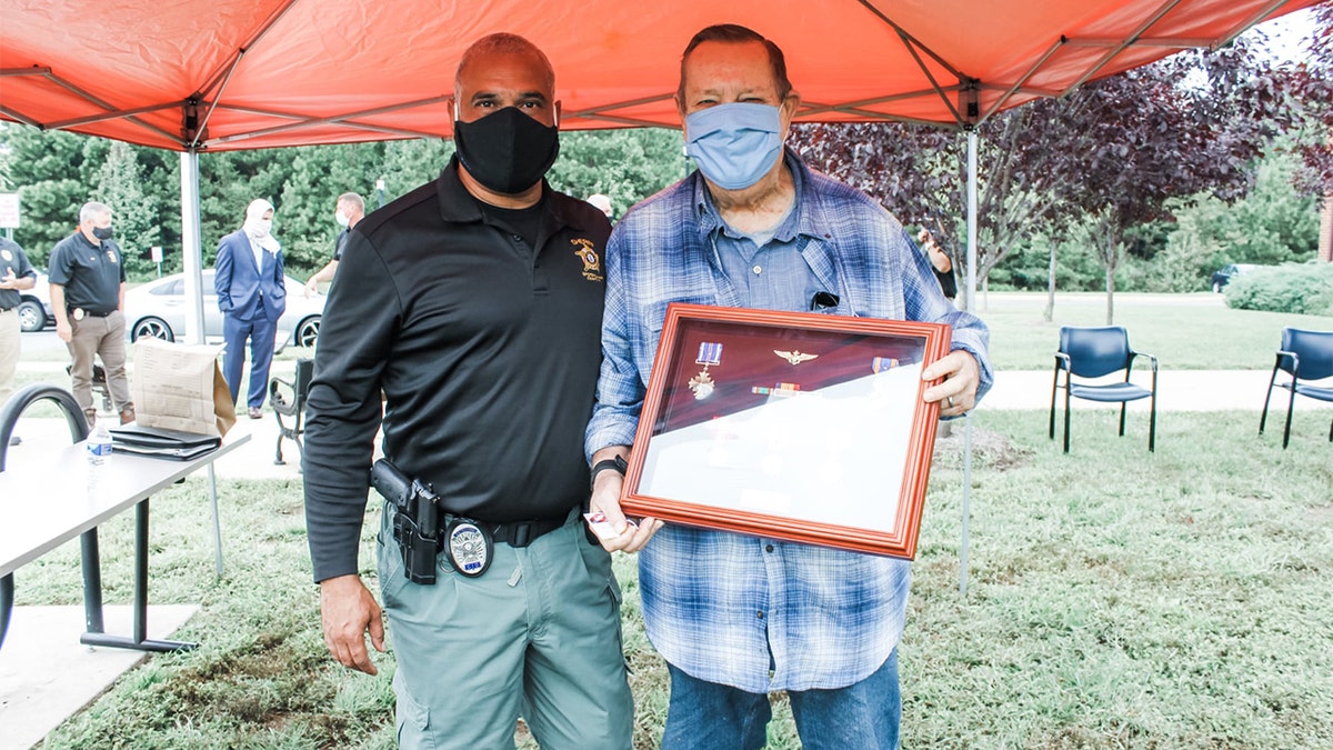 Detective Frank Corona, left, and retired Marine Corps. Lt. Col. Thomas Faleskie.