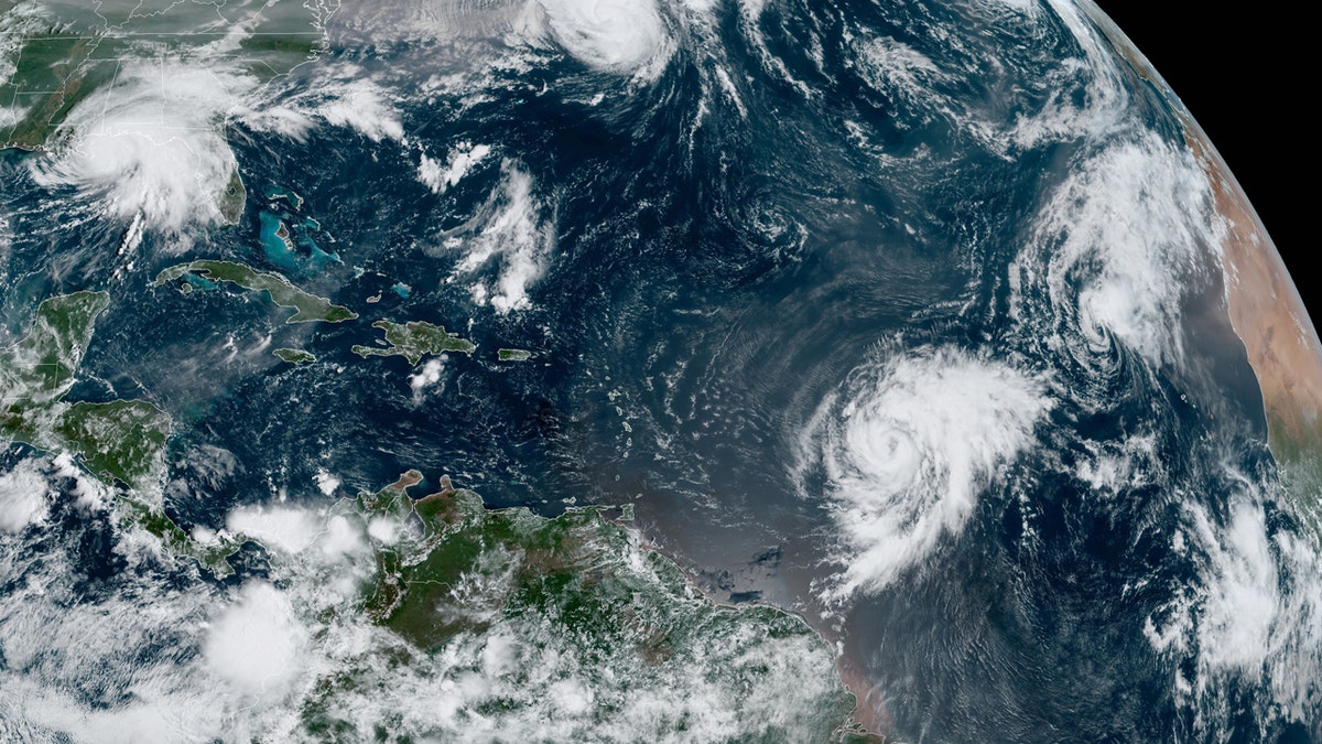 Hurricane Sally swirls near the Gulf Coast (top left) as Hurricane Paulette moves away from Bermuda and other systems swirl in the Atlantic Ocean on Sept. 15, 2020.