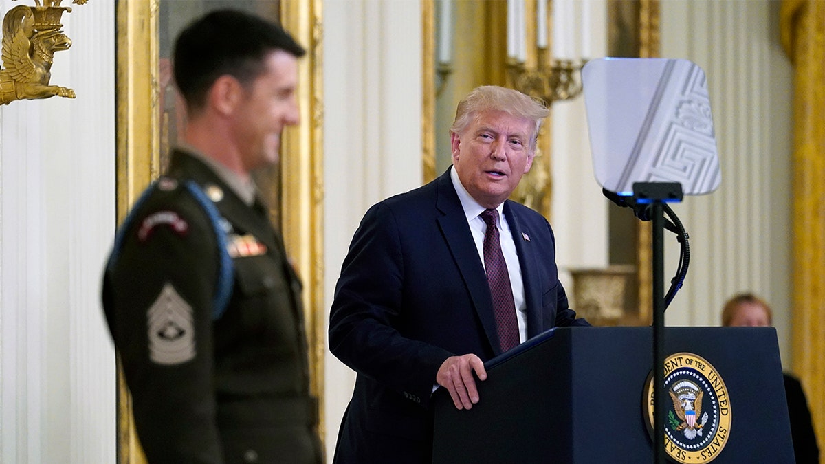 President Donald Trump awards the Medal of Honor to Army Sgt. Maj. Thomas P. Payne in the East Room of the White House on Friday, Sept. 11, 2020, in Washington. (AP Photo/Andrew Harnik)