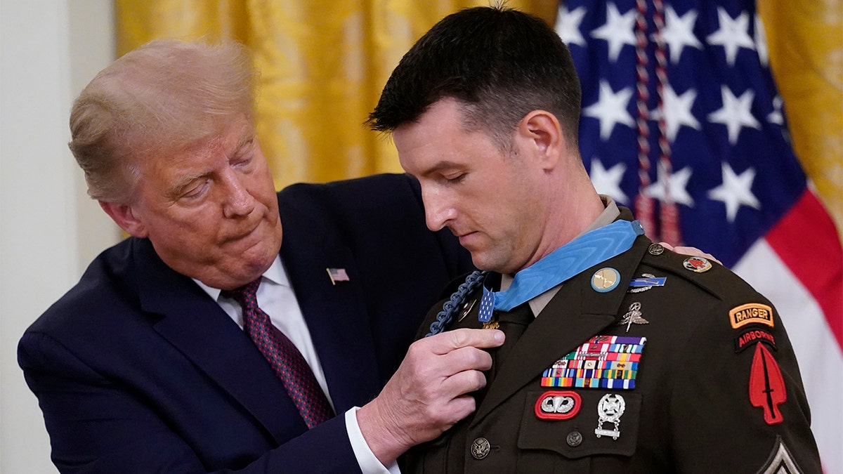 President Trump awards the Medal of Honor to Army Sgt. Maj. Thomas P. Payne in the East Room of the White House on Friday, Sept. 11, 2020, in Washington. (AP Photo/Andrew Harnik)