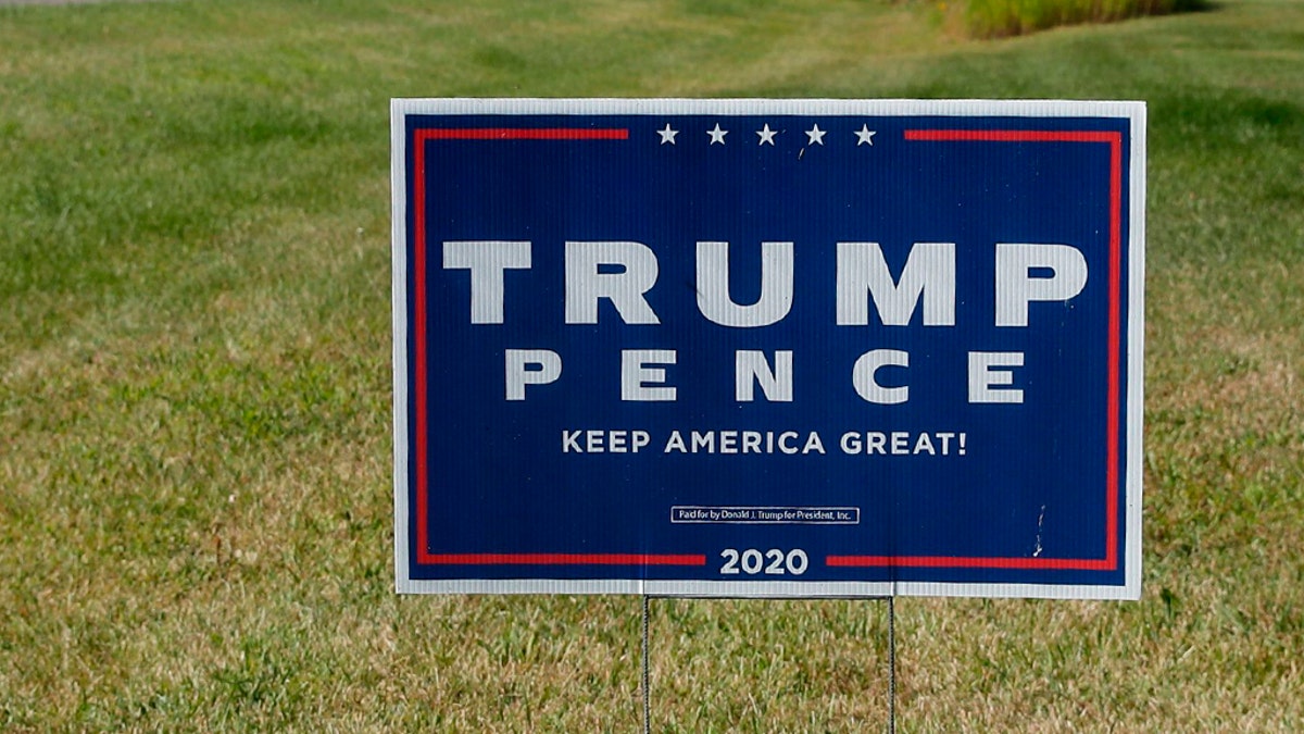 A sign supporting US President Donald Trump and US Vice President Mike Pence. (Photo by KAMIL KRZACZYNSKI / AFP) (Photo by KAMIL KRZACZYNSKI/AFP via Getty Images)