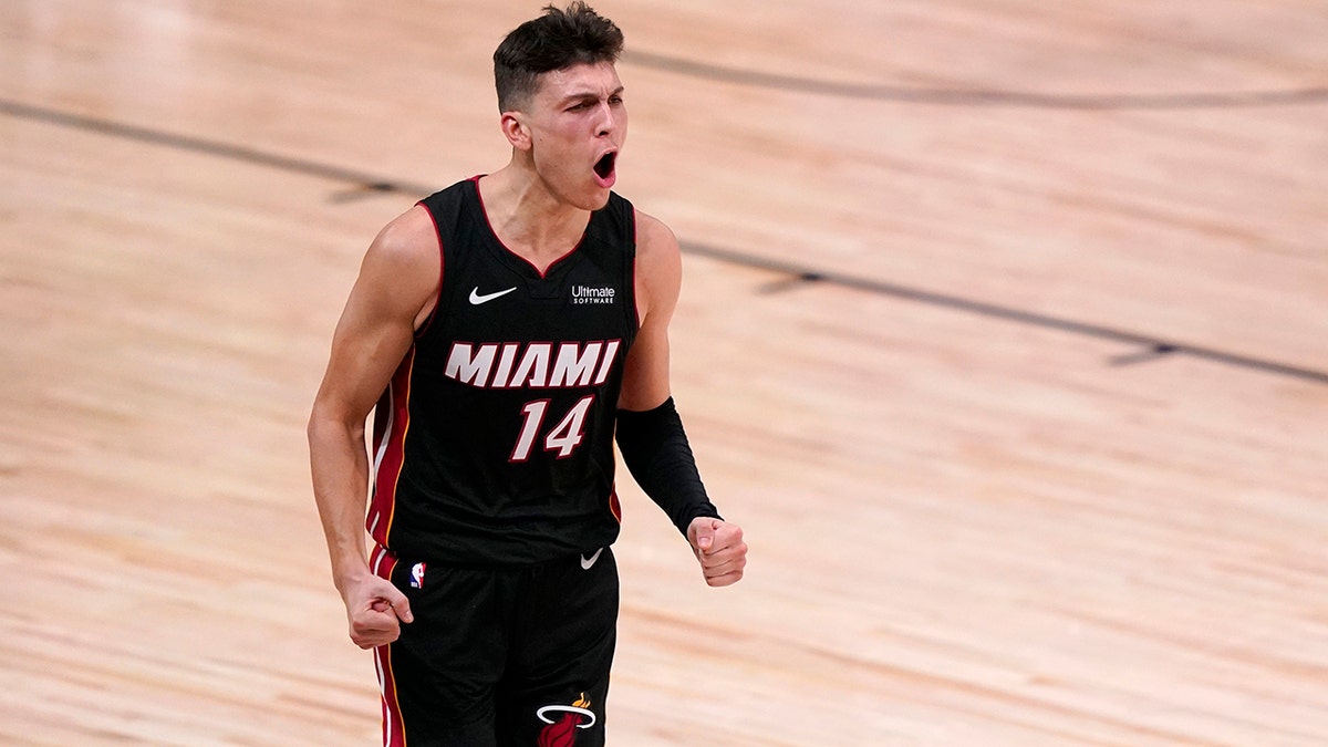 Miami Heat guard Tyler Herro (14) celebrates a basket against the Boston Celtics late in the second half of Game 4 of an NBA basketball Eastern Conference final, Wednesday, Sept. 23, 2020, in Lake Buena Vista, Fla. (AP Photo/Mark J. Terrill)