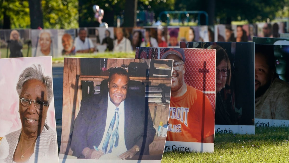 Some of the nearly 900 large poster-sized photos of the local victims. (AP)