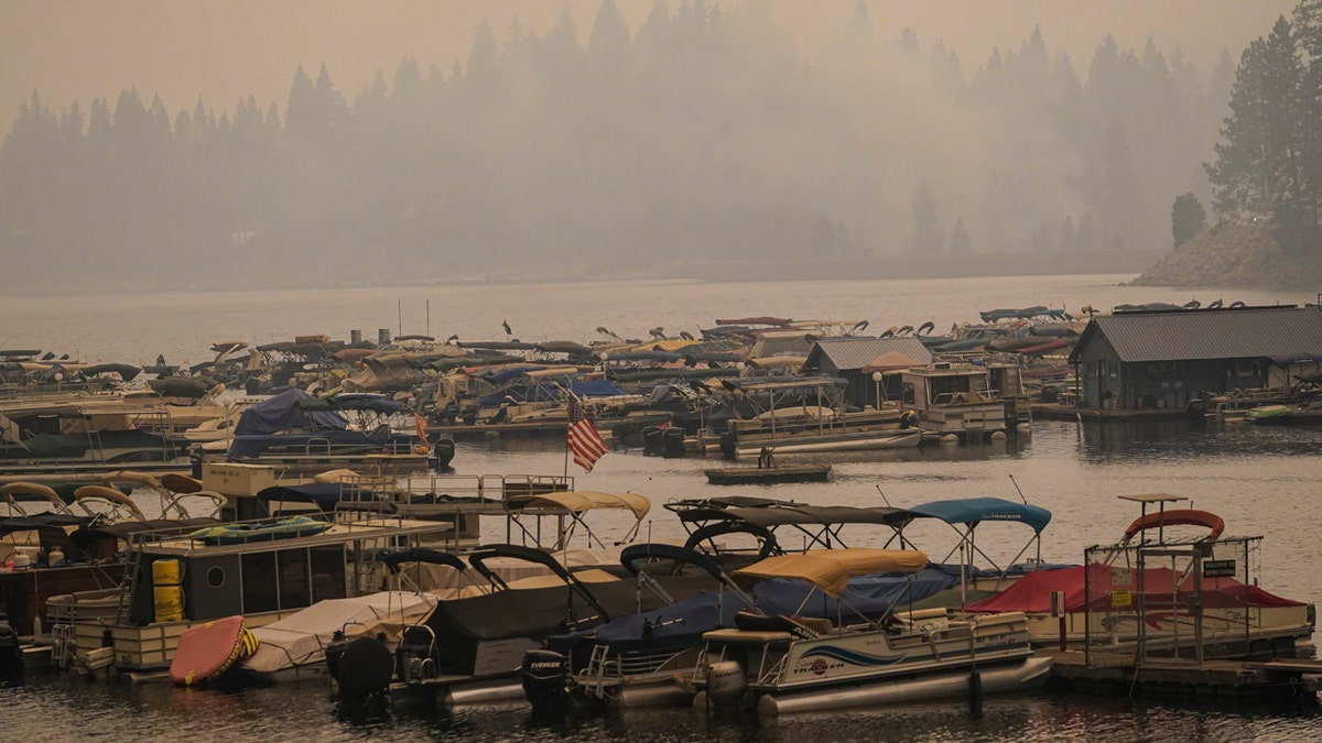 Smoke from the Creek Fire fills the air over a marina, Monday, Sept. 7, 2020, in Shaver Lake, Calif.