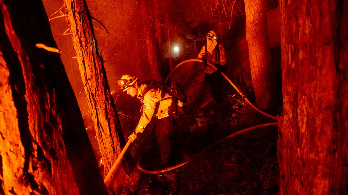 Firefighter Nick Grinstead battles the Creek Fire in the Shaver Lake community of Fresno County, Calif., on Monday, Sept. 7, 2020.