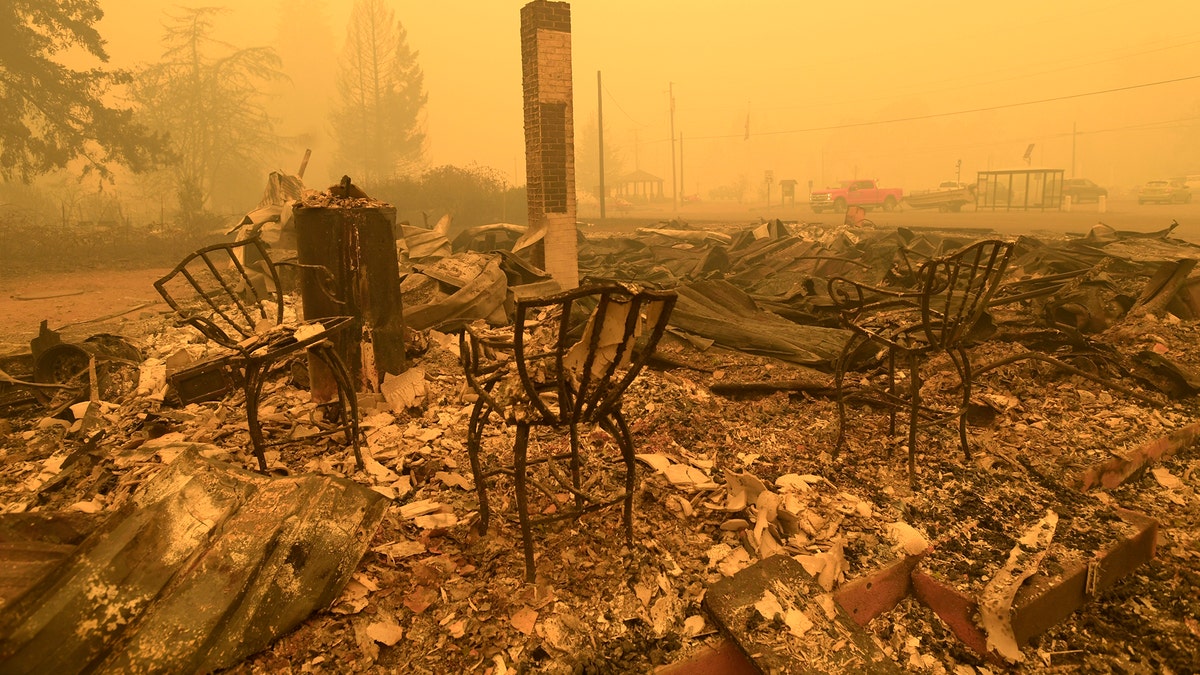 Three chairs are all that remain at the Gates post office in Gates, Ore., Wednesday, Sept 9, 2020. (Associated Press)