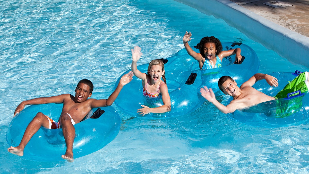 kids swimming in a pool