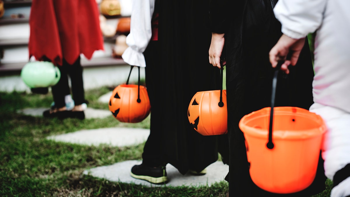 Closeup look at Halloween buckets and costumes