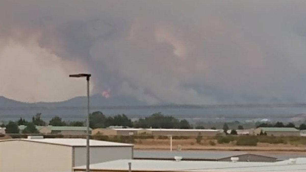 Smoke and flames from wildfires near Medford, Ore. on Tuesday, Sept. 8, 2020.