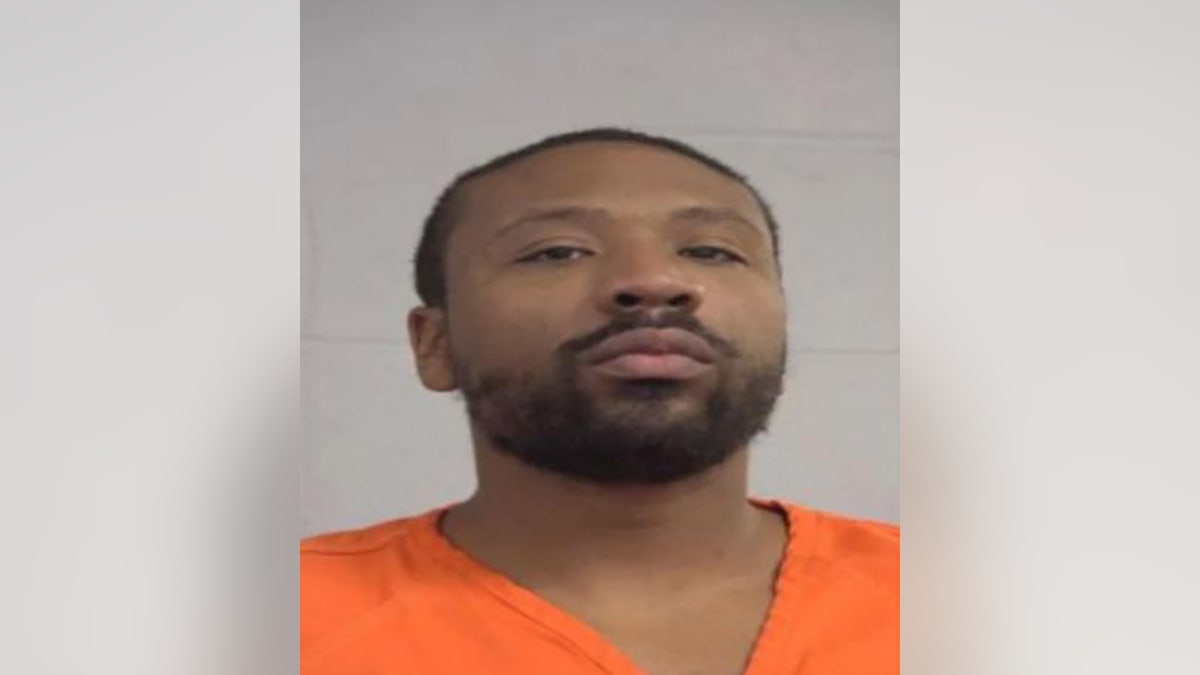 Michael E. Rhynes Jr., 33, was charged with three counts of murder and was held on a $2 million bond. (Louisville Metro Corrections)