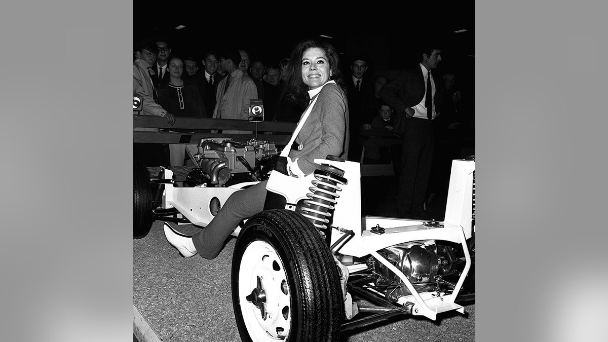 Rigg appeared on the Lotus stand at the 1965 Earl's Court Motor Show.