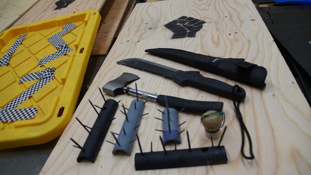 Seattle police discovered spike strips, weapons and dozens of makeshift shields inside tents at a park in the Capitol Hill neighborhood on Tuesday.