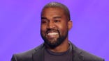 FILE - This Nov. 17, 2019, file photo shows Kanye West on stage during a service at Lakewood Church in Houston. A law firm with ties to prominent Democrats has filed a lawsuit attempting to keep West off presidential ballots in Virginia. Attorneys for Perkins Coie filed a lawsuit in Richmond on Tuesday, Sept. 1, 2020, on behalf of two people who say they were tricked into signing an “Elector Oath” backing West's candidacy. (AP Photo/Michael Wyke, File)