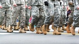 Soldiers dressed in army camouflage in an army parade