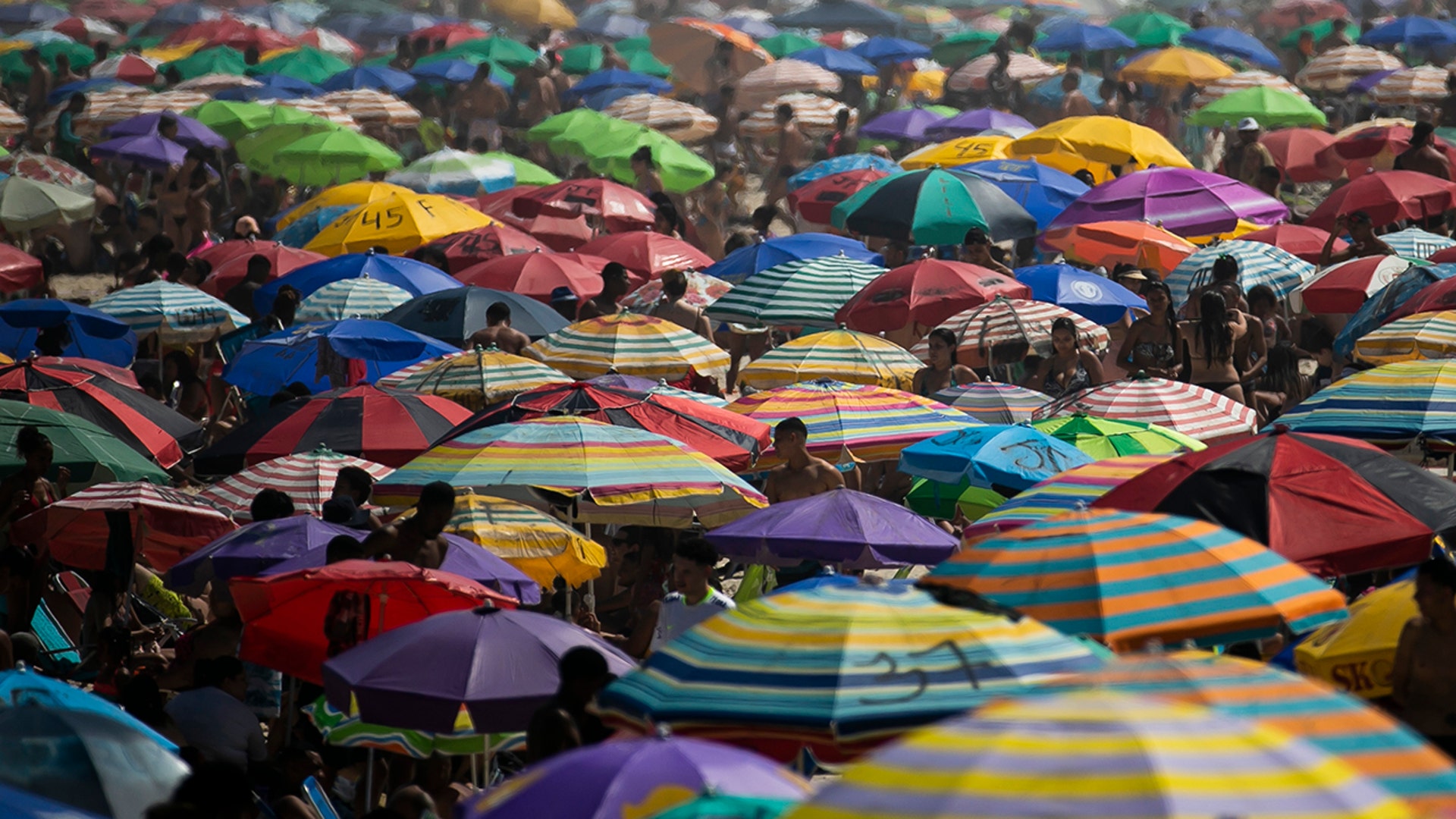 People enjoy the Ipanema beach amid the new coronavirus pandemic in Rio de Janeiro, Brazil, Sept. 6, 2020. 